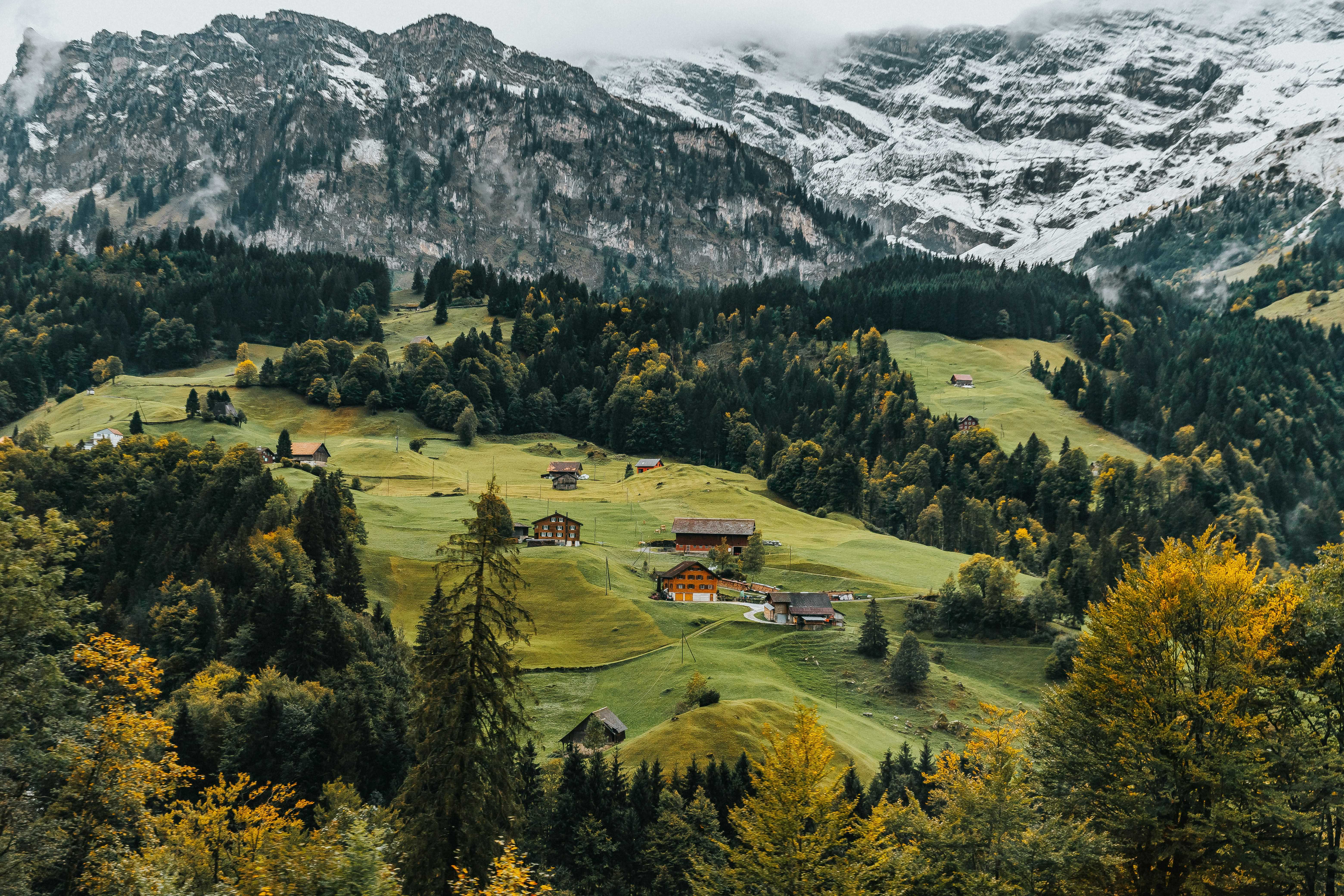 Swiss alpine valley in autumn representing strategic wealth management and growth